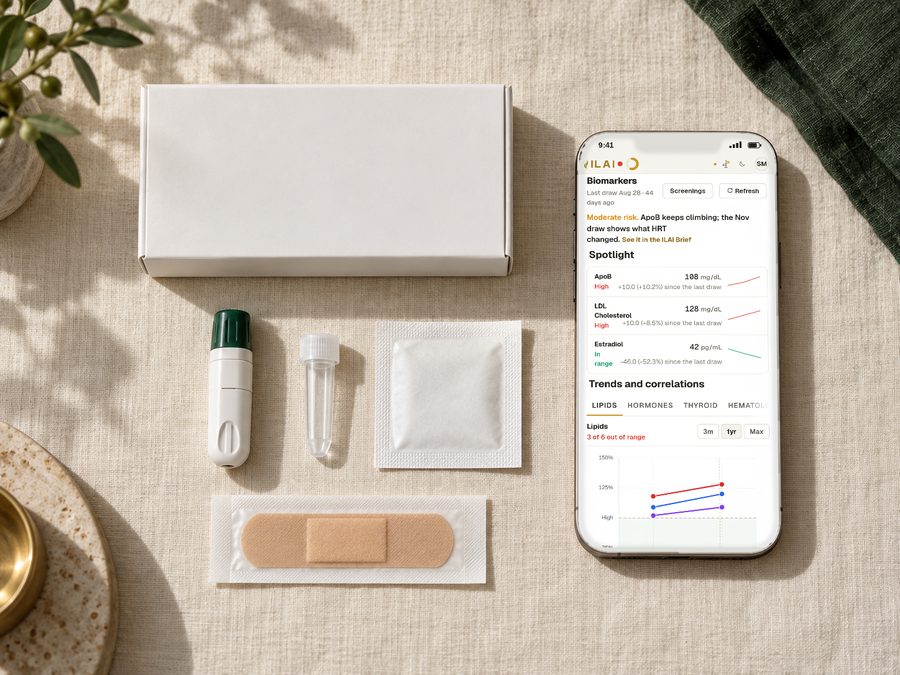 An ILAI collection kit laid out on linen: the box, the collection device, a sample tube, a gauze pad and a plaster, next to a phone showing lab trends